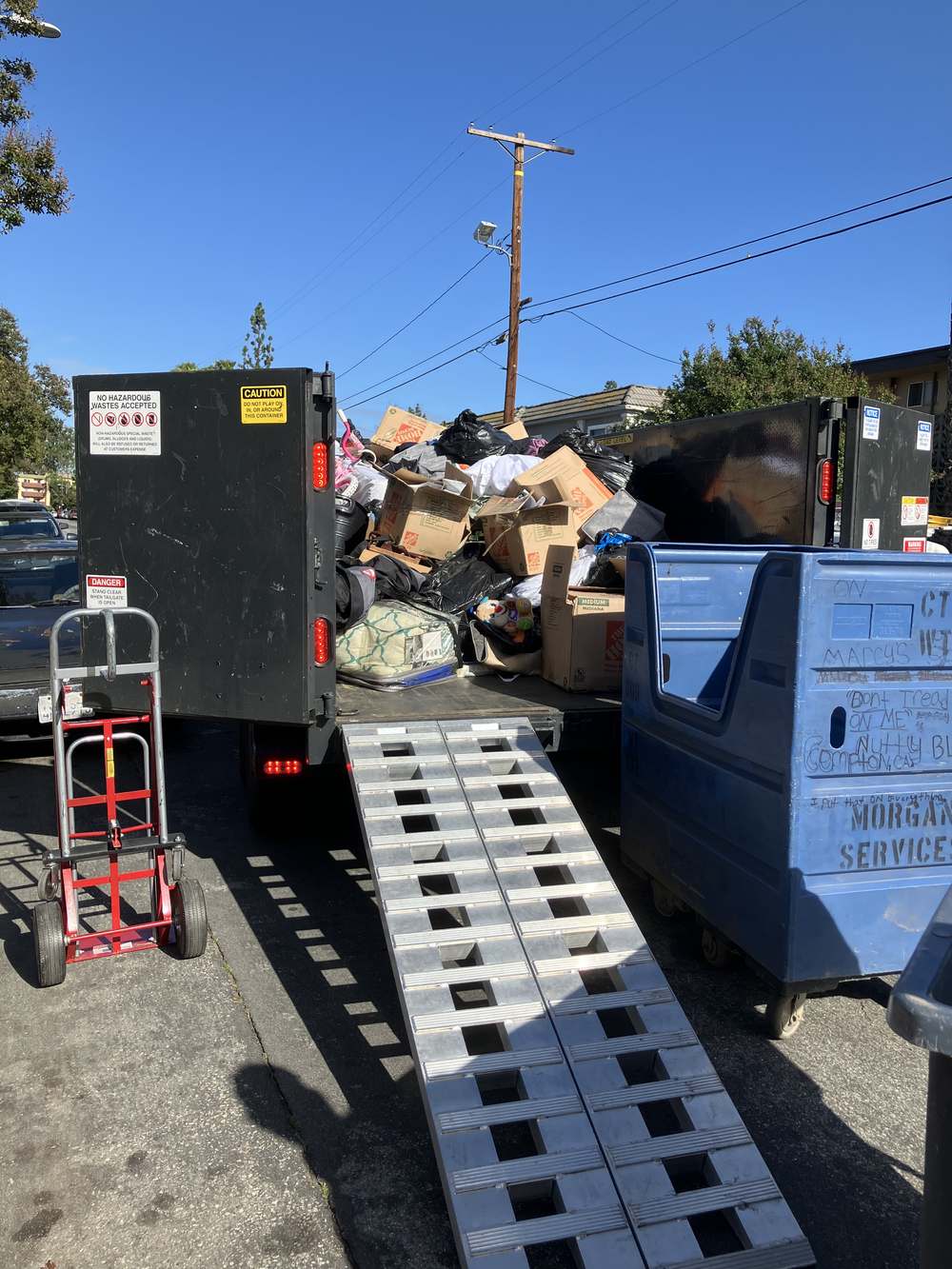 Loaded trailer from a full property cleanout in Granada Hills, boxes and furniture ready to haul away