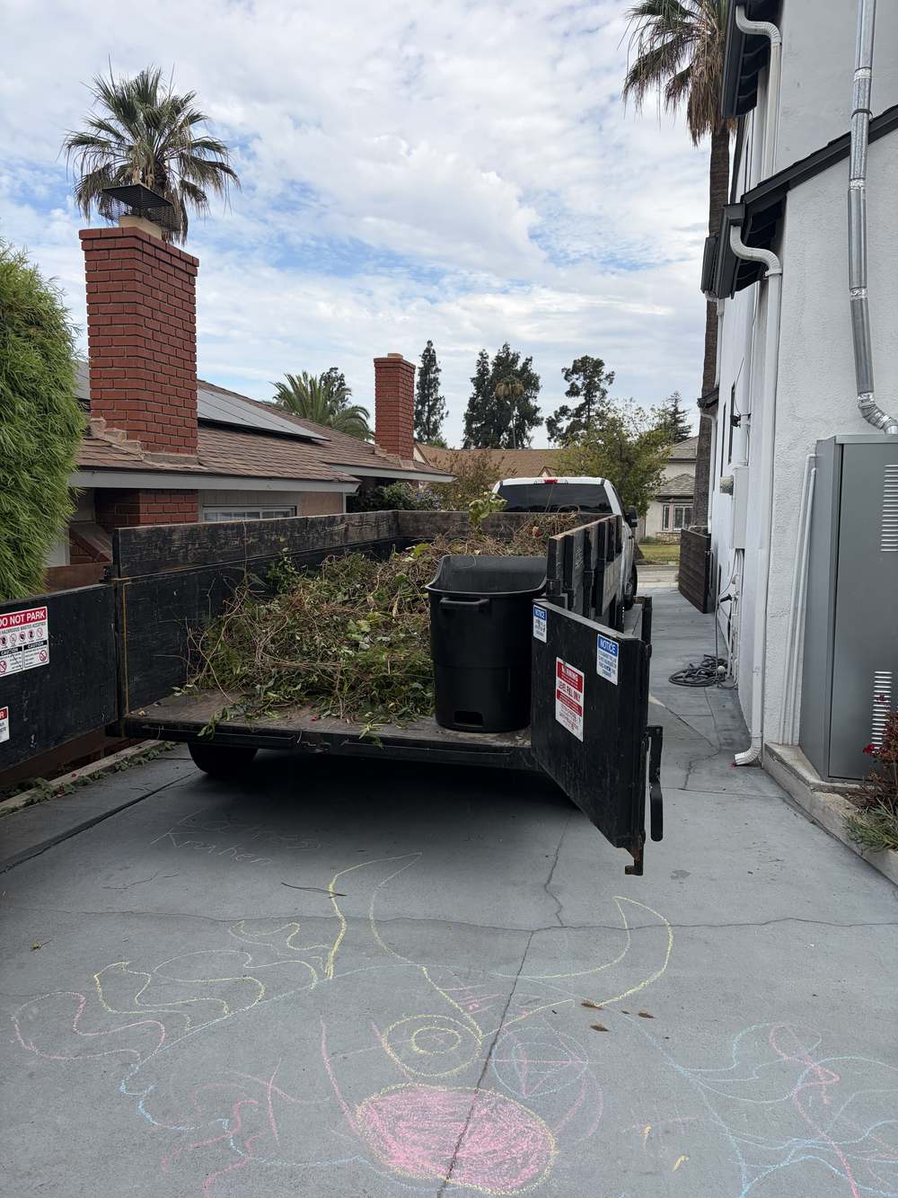 Trailer loaded with green waste and yard debris from a Granada Hills property